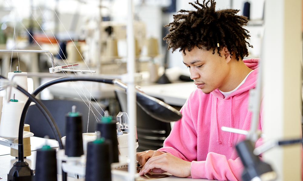 Student in sewing lab